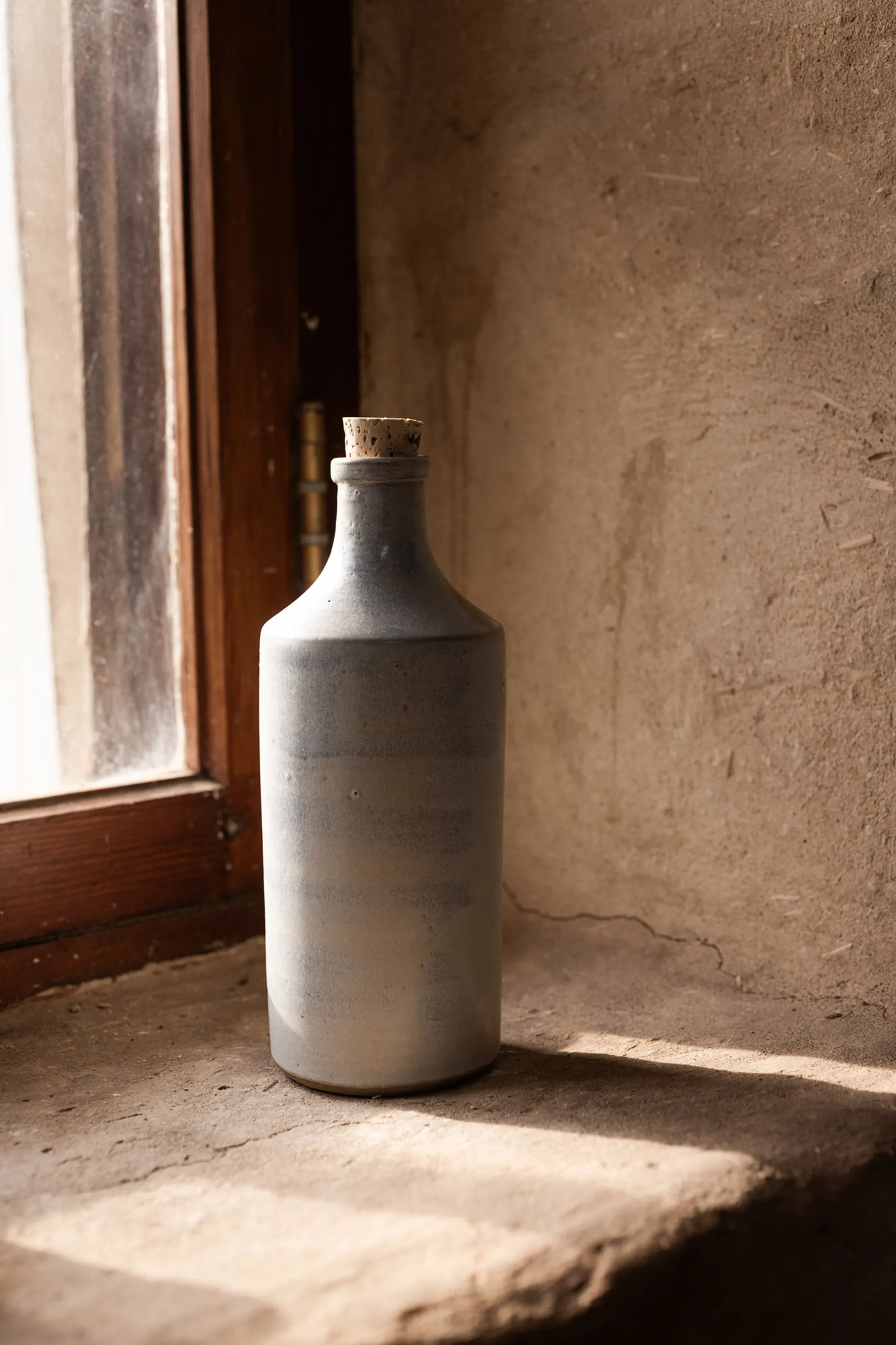 Ceramic bottle with pour spout and tasting oil